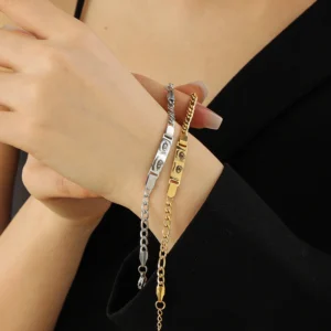 Woman modeling matching gold and silver engraved eye bracelets - personalized his & hers couple jewelry set